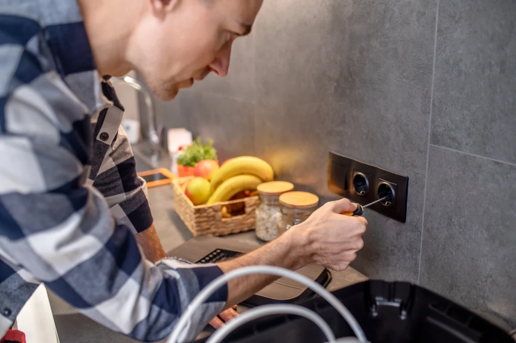 Emergency electrician in Solihull working on power socket